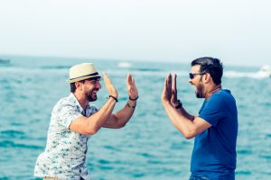 Two friends making jokes about their past date.